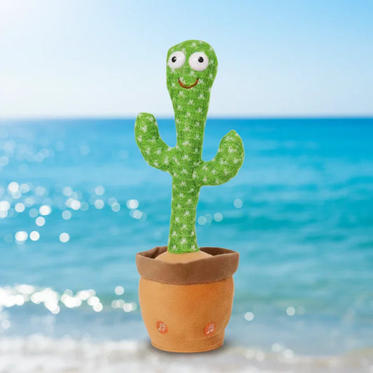 Dancing cactus plush toy in a pot with smiley face, displayed on a beach background