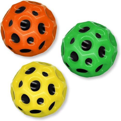 Three textured rubber dog toys in orange, green, and yellow, each featuring a honeycomb pattern with black circular holes, shown on a white background.