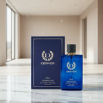 Denver Pride Hamilton perfume blue bottle and box on a marble surface in a modern room