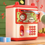A children's toy credit card money box with a red and cream-colored body, cartoon graphics on the front, a simulated card slot, and a printed keypad. A child's hand is shown inserting a toy credit card into the slot.