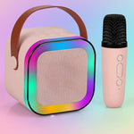 Pink portable Bluetooth speaker with LED lights and matching wireless microphone