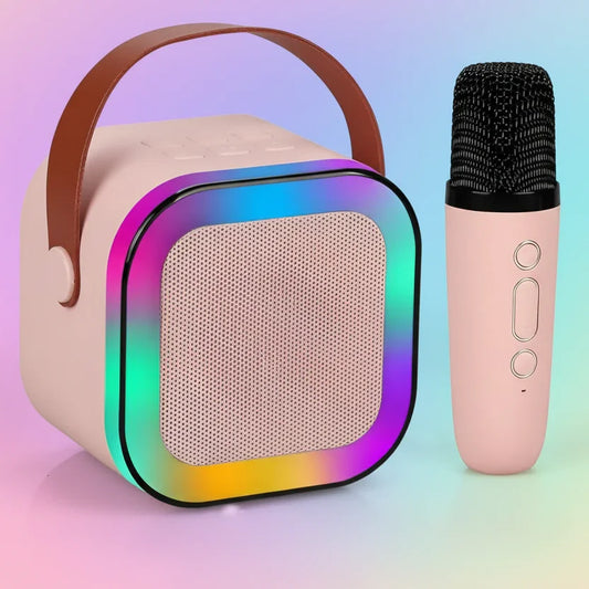 Pink portable Bluetooth speaker with LED lights and matching wireless microphone